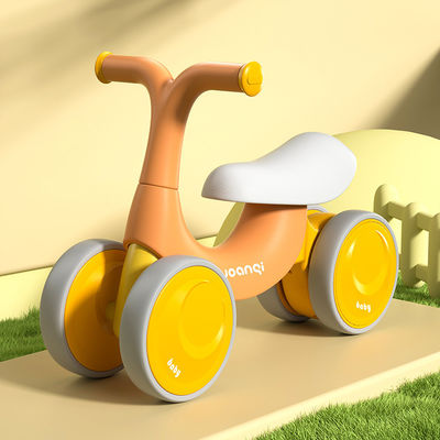 Carro de equilibrio de bebé de plástico naranja con patinaje en rodillos silencioso y diseño verde
