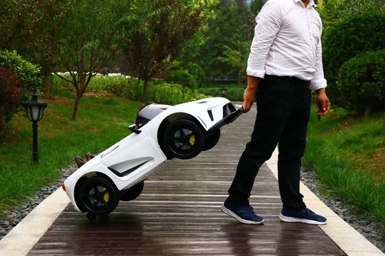 Unisex niños 12v coche eléctrico con control remoto doble conducción música y función de swing