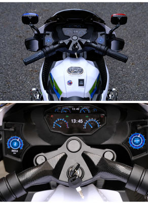 Motocicleta eléctrica de tres ruedas para niños en rojo/blanco/plata/negro