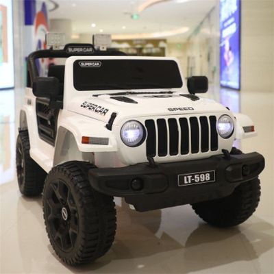 Los niños viajan en un coche eléctrico 12V de 2 plazas con control remoto y batería recargable