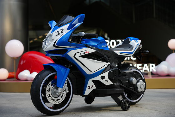Fabricado 12V eléctrico de motocicleta con música e iluminación LED para niños