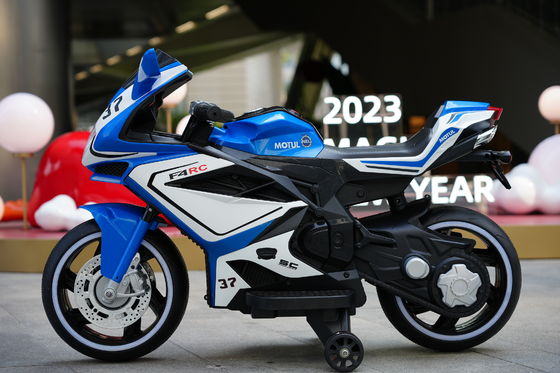 Fabricado 12V eléctrico de motocicleta con música e iluminación LED para niños